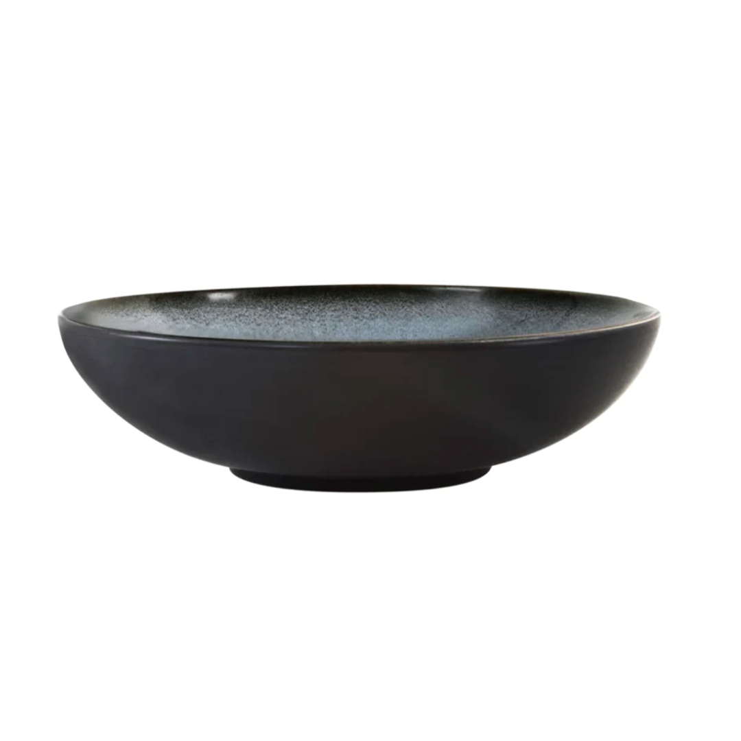 The Tourron Ecorce Dinnerware Bleu & Grey by Jars - Rosenthal is a round, shallow stoneware bowl featuring a smooth dark exterior and speckled light interior, handmade in France and shown against a plain white backdrop.