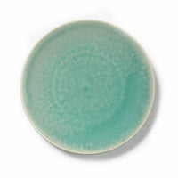 The Tourron Dinnerware Jade plate by Jars - Rosenthal features a round ceramic design with a matte jade glaze and subtle speckled texture. A lighter rim gently fades into the main color—timeless dinnerware captured from above.