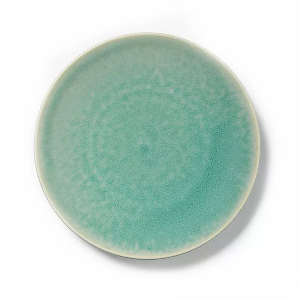 The Tourron Dinnerware Jade plate by Jars - Rosenthal features a round ceramic design with a matte jade glaze and subtle speckled texture. A lighter rim gently fades into the main color—timeless dinnerware captured from above.