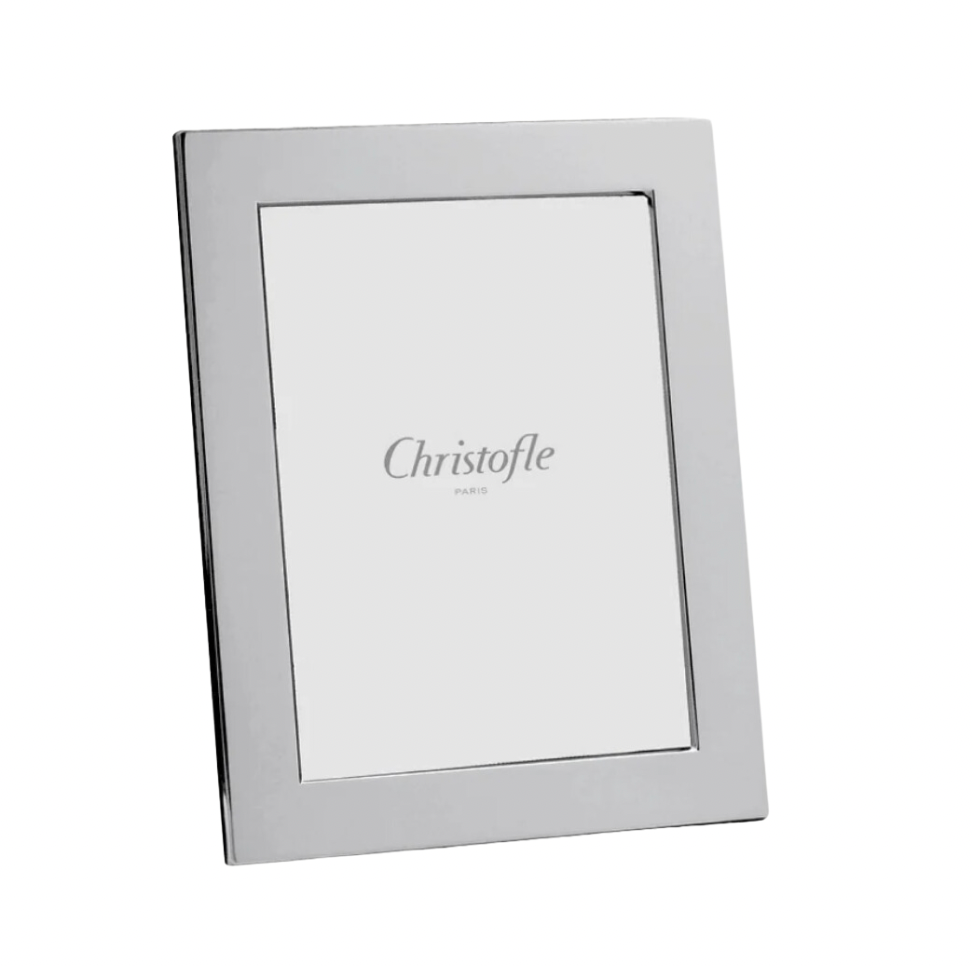 The Fidelio Christofle Silver Plated Frame 7x9.5 is a simple, rectangular photo frame with a wide silvered border and a plain insert displaying “Christofle Paris” at the center.