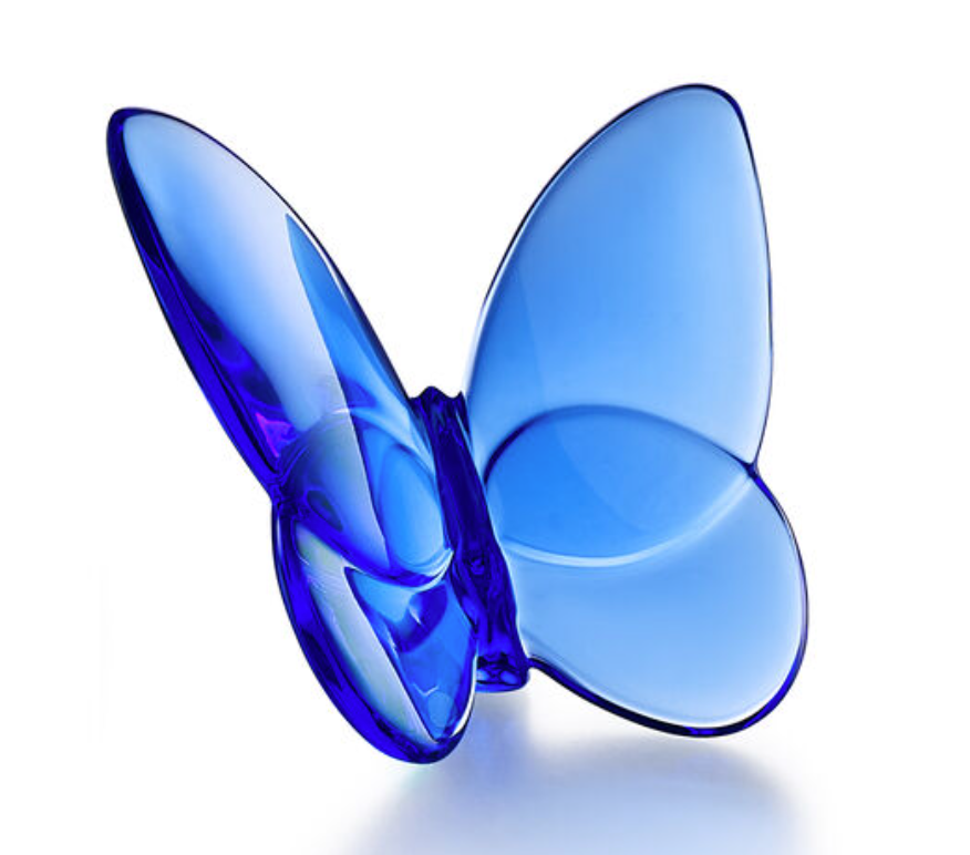 The Papilion Lucky Butterfly by Baccarat is a smooth, translucent blue crystal figurine with open wings, displayed against a white background.