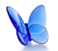 The Papilion Lucky Butterfly by Baccarat is a smooth, translucent blue crystal figurine with open wings, displayed against a white background.