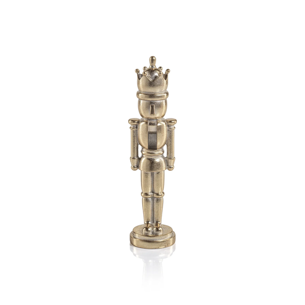 A minimalist gold-colored Zodax Nutcracker Gold Statue figurine wearing a crown.