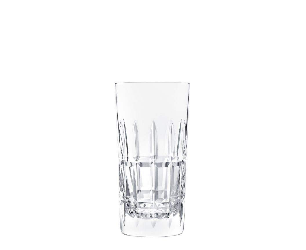 A Saint-Louis Manhattan Barware highball glass with a faceted cut-crystal design stands upright empty on a plain white background.