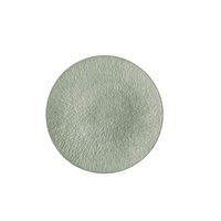 A round, light green Limoges porcelain plate from Raynaud’s Mineral Irise Dinnerware - Celadon collection, featuring a textured radial pattern, is displayed on a plain white background.