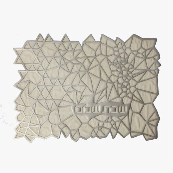 The Apeloig Geometric Challah Cover features an intricate, modern pattern of light-colored, interconnected polygons—mainly triangles and quadrilaterals—with a subtle texture, evoking the look of a laser-cut design.