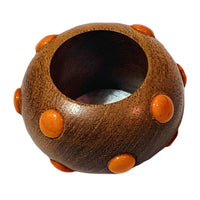The Candy Dots Napkin Ring Set of 4 by Von Gern Home features round brown wooden beads with orange raised dots, adding playful style to your table and making your colorful napkin rings display stand out.