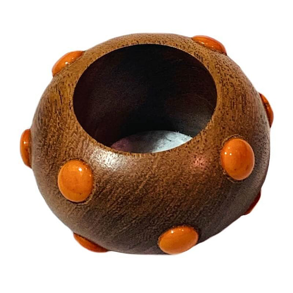 The Candy Dots Napkin Ring Set of 4 by Von Gern Home features round brown wooden beads with orange raised dots, adding playful style to your table and making your colorful napkin rings display stand out.