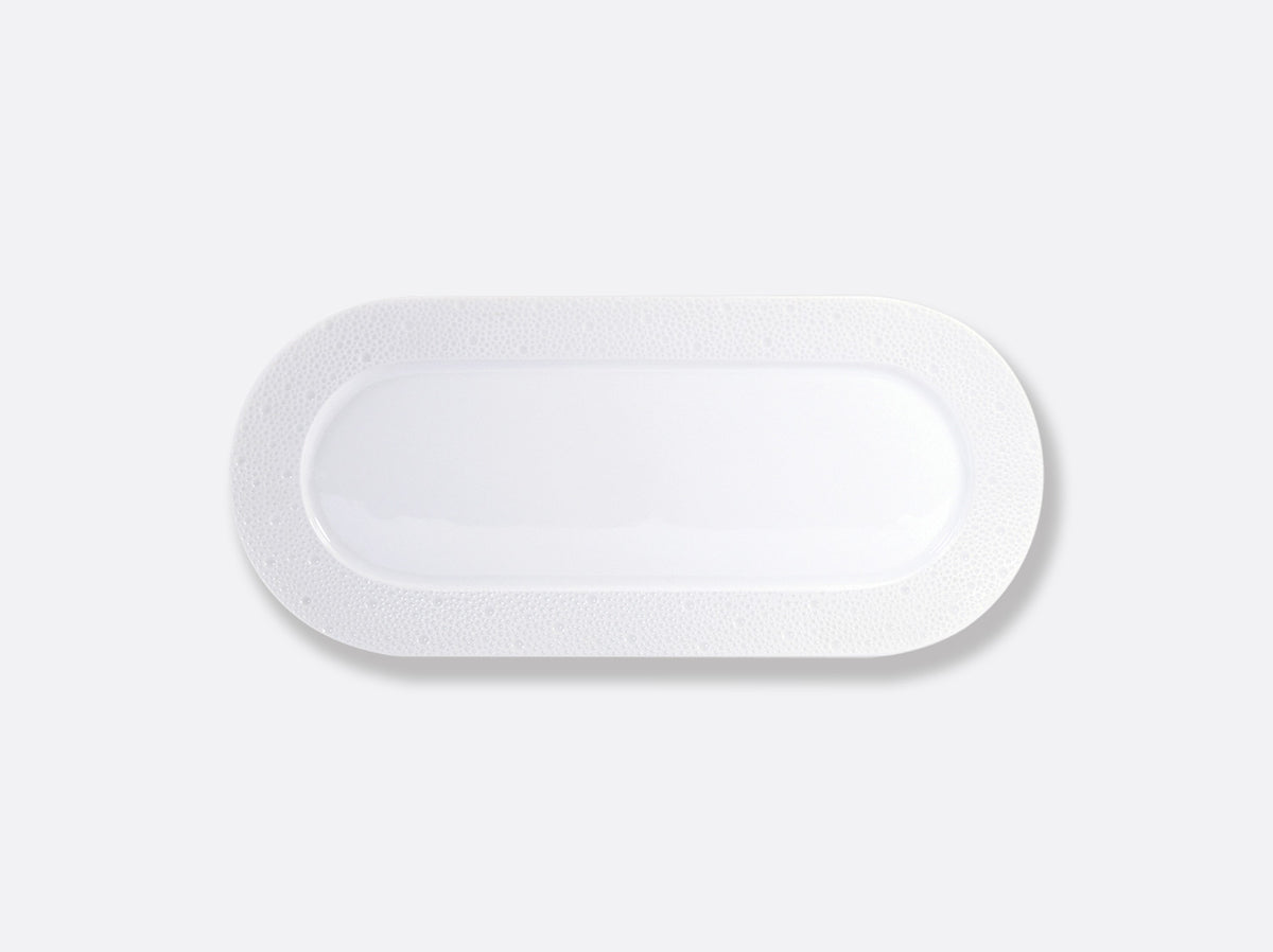 A rectangular white medical adhesive bandage with rounded edges, displayed on a plain light gray background, appears as pristine and elegant as Bernardaud Ecume White Dinnerware.