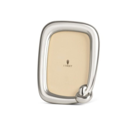 A rectangular silver-toned L’Objet Jessica McCormack Knot Frame Platinum featuring a distinctive knotted detail at the bottom corner.