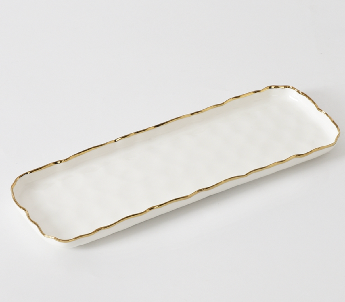 The PAMPA BAY Portofino Rectangle Tray is a white porcelain serving tray with a wavy gold-trimmed rim, shown on a plain white background.