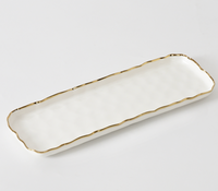 The PAMPA BAY Portofino Rectangle Tray is a white porcelain serving tray with a wavy gold-trimmed rim, shown on a plain white background.