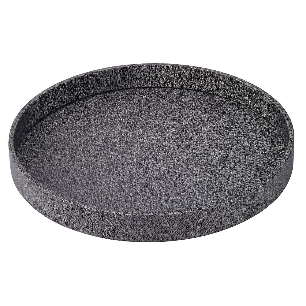 The Bodrum Skate Round Tray - Charcoal is a round, shallow serving tray with a textured, phthalate-free surface and raised edges, shown here in dark gray on a white background.