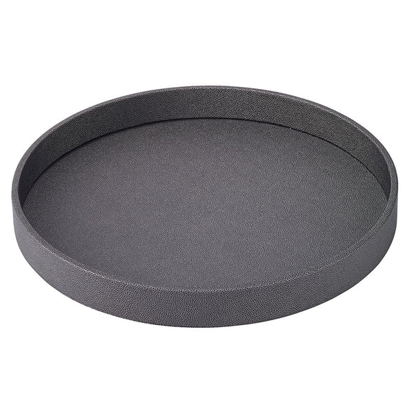 The Bodrum Skate Round Tray - Charcoal is a round, shallow serving tray with a textured, phthalate-free surface and raised edges, shown here in dark gray on a white background.
