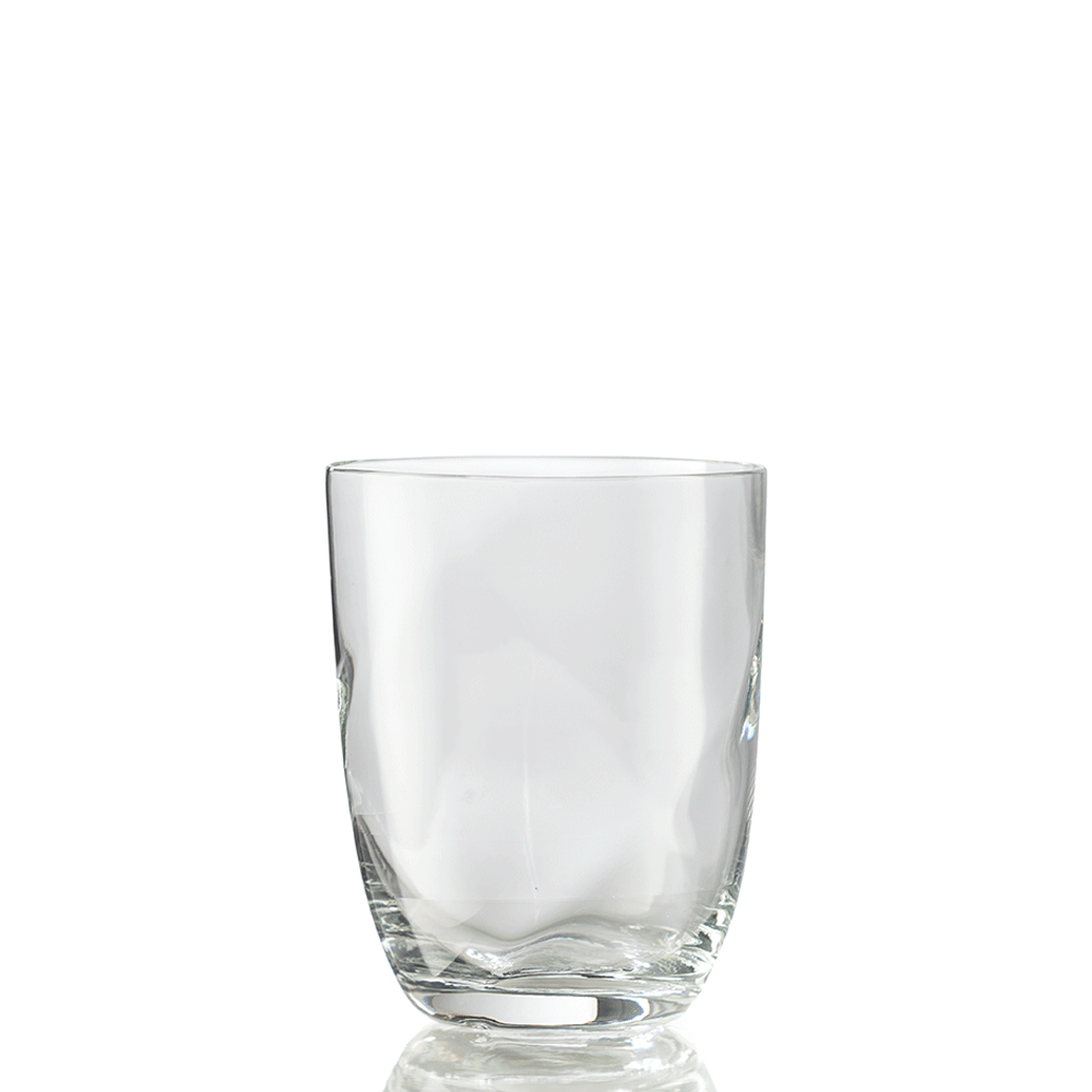 The Idra Tumbler Lente by Nason Moretti is shown upright on a white background, its clear glass reflecting light at the base.
