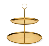 The Sinta 2 Tier Stand by Aerin features shiny, circular brass plates and a round handle, perfect for serving or displaying food in authentic Mid-Century Modern style.