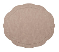 The Kim Seybert Tailored Placemat Taupe Set of 4 features round, taupe faux leather placemats with wavy, scalloped edges and subtle stitched borders, shown isolated on a white background.