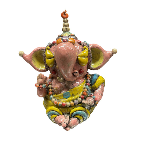 The Currey & Company Golden Fortune Ganesha Sculpture depicts the Hindu deity with large pink ears, yellow and blue attire, and beaded necklaces, seated with a blessing hand—perfect as meditation décor and displayed on a white background.