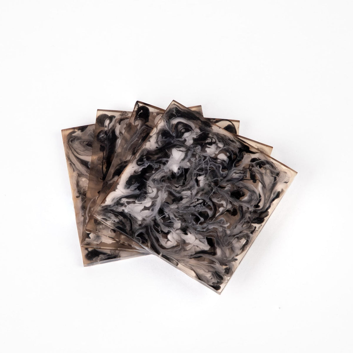 The Agatha Resin Coasters Set of 4 by Go Home features square coasters with a marbled swirl pattern in black, white, and gray, adding modern style to any setting.