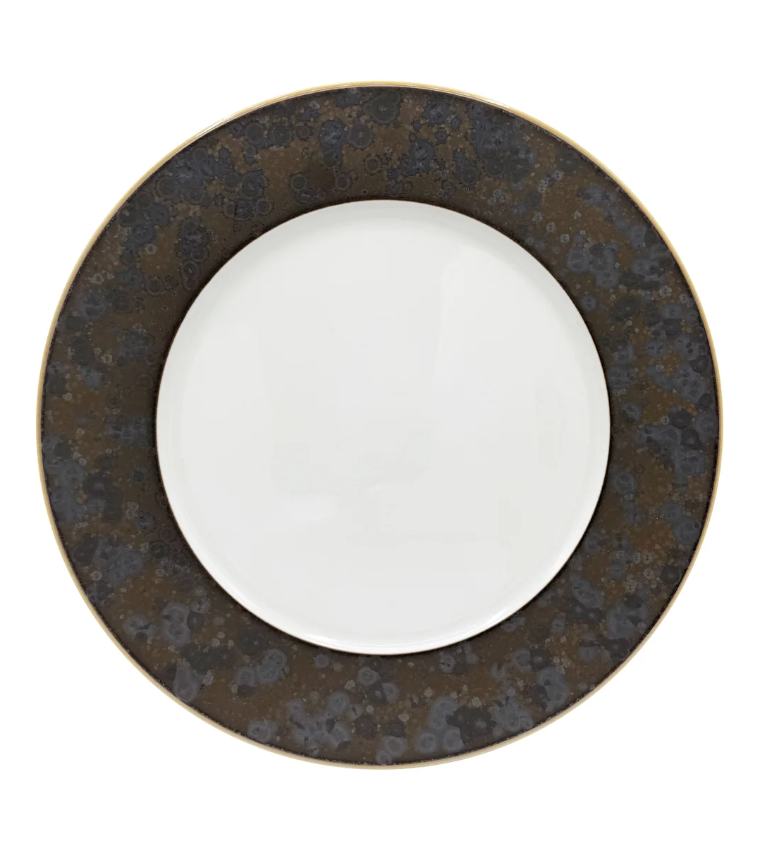 The Aguirre Dinnerware by Jaune De Chrome features a round ceramic plate with a wide, dark brown patterned rim and a plain white center, shown from above against a white background—an elegant piece that captures the timeless style of French dinnerware.