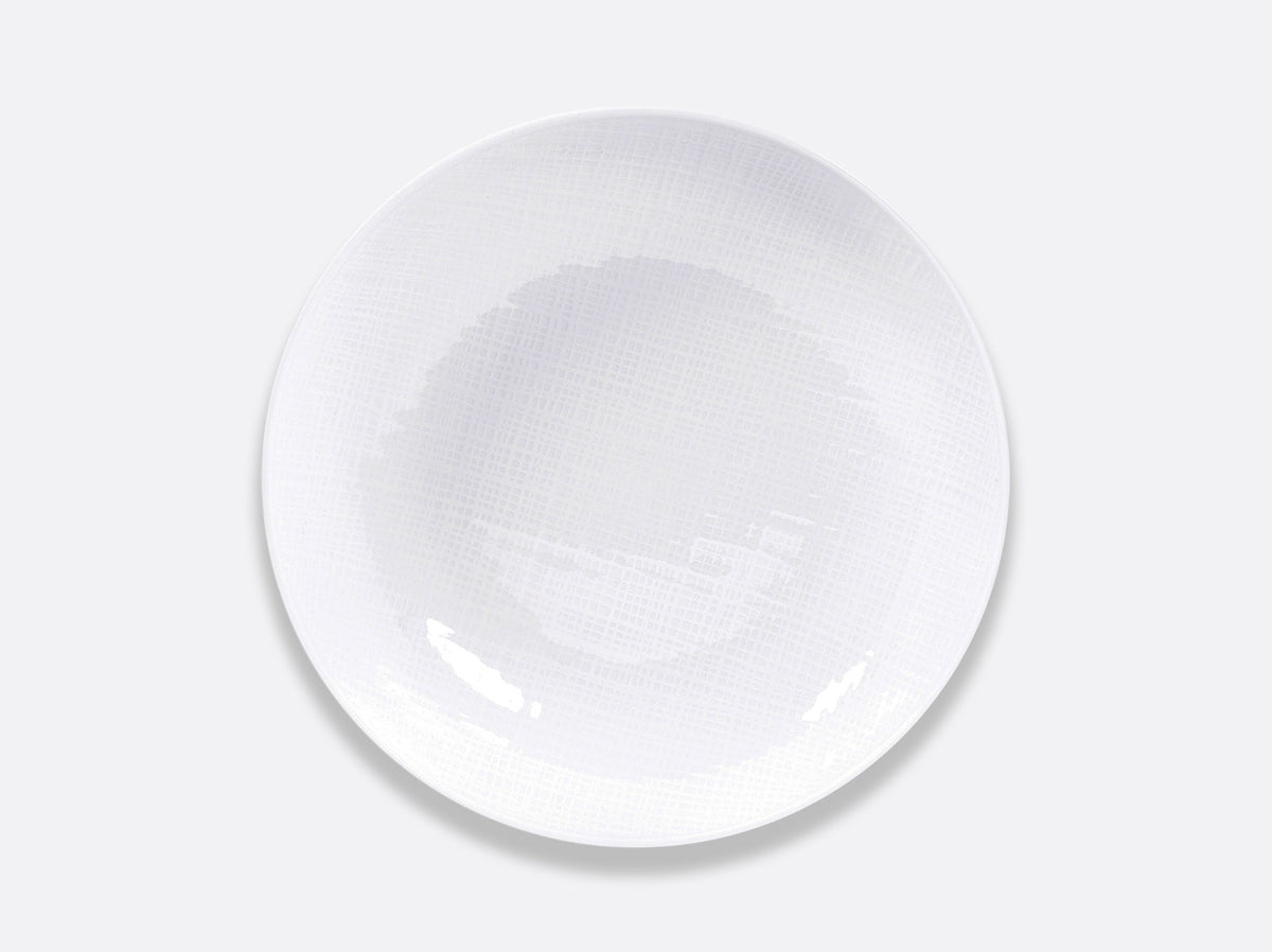 A round, white Bernardaud Organza White Dinnerware porcelain plate featuring a subtle textured pattern, photographed from above on a plain light gray background.