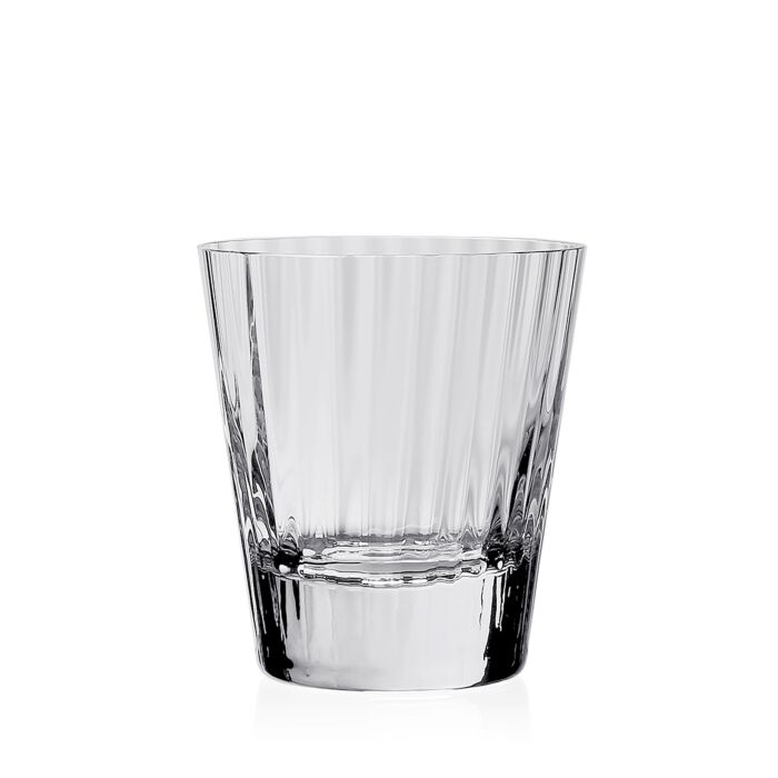 The Corinne Drinkware by William Yeoward is a clear, empty glass tumbler featuring vertical etched lines for an optic effect, adding contemporary barware style against a plain white background.