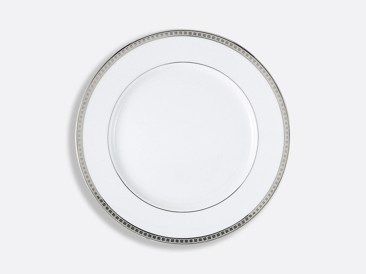 The Bernardaud Athena Platinum Dinnerware plate is round, white porcelain with a platinum geometric rim, shown on a light gray background.