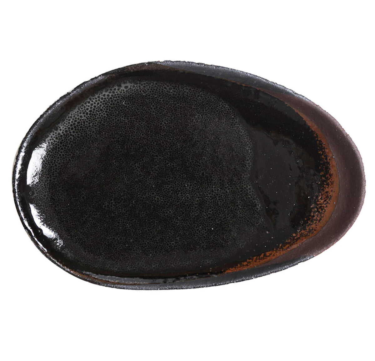 The Wabi Kemuri oval plate by Jars features a glossy, near-black ceramic interior with subtle brown edge accents, hand-crafted in the Japanese Wabi Sabi tradition and shown against a white background.