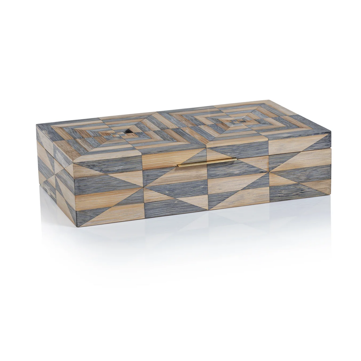 The Monarch Bamboo Box with Brass Trim by Zodax features a rectangular design with a geometric pattern in shades of gray, beige, and tan. Interlocking triangles and parallelograms are displayed on its glossy surface, while elegant brass trim adds a sophisticated finishing touch.