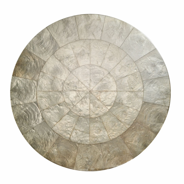 The Capiz Shell Placemat Grey Set of 4 by Kim Seybert features elegant round placemats with a mosaic of silver-gray segments, arranged in concentric rings for a sophisticated look.