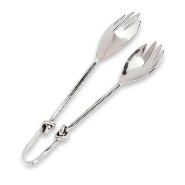 A pair of Abbott Collection Knot Serving Tongs, featuring forked, spoon-like ends and a distinctive knotted hinge, lies on a white background.