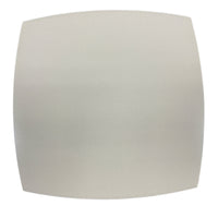 A square, light gray plate with a subtle texture sits on Julian Mejia's Ellipse Reversible Placemat Set of 4 in Azure Eggshell, photographed on a white background in the style of Current Home NY.