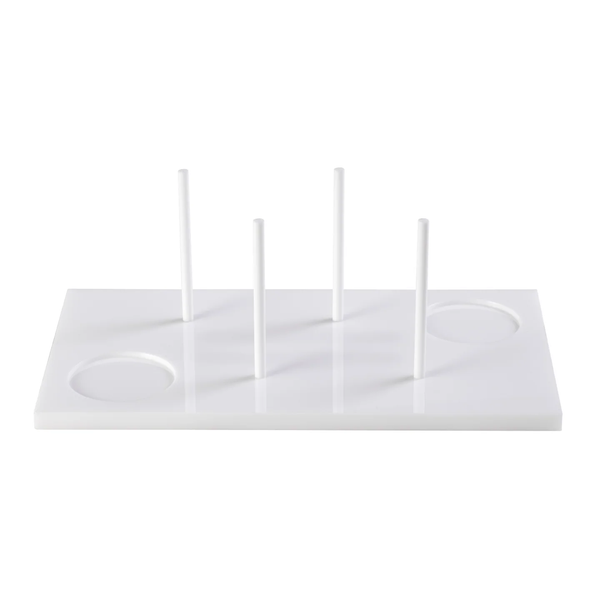 The Acrylic Bagels On Board Tray - White by Inspired Generations is a white rectangular acrylic tray featuring four vertical rods and two circular indents, perfect for organizing or holding items upright—an ideal and stylish choice for serving bagels at your next brunch board.