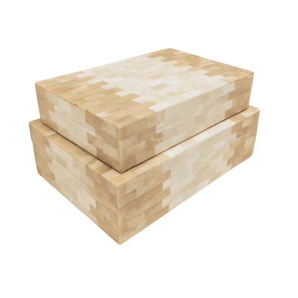 Two rectangular Subwaya Box Ivory & Beige by A Sanoma Inc, in light tan and cream with a pixelated checkerboard pattern—ideal for bringing minimalism and modern luxury to any space.