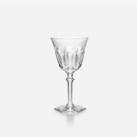 A Baccarat Eve Wine Glass, featuring a decorative bowl, slender stem, and square base, is displayed against a plain white background.