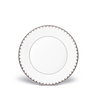A round white Aegean Filet Platinum Dinner Plate by L’Objet features a scalloped platinum border, shown on a plain white background—an elegant example of L’Objet dinnerware.