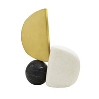 The Hiroshi Sculpture by Arteriors features three striking forms: a black marble sphere, a white rounded block, and a vertically standing gold semicircle, all artfully balanced on a flat surface against a white background. Inspired by cubist art, this modern piece evokes minimalist elegance and refined design.