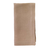 The Bodrum Riviera Napkin Set of 4 is displayed, featuring neatly folded light brown, stone-washed linen napkins against a white background.