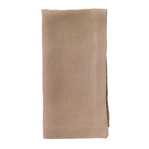 The Bodrum Riviera Napkin Set of 4 is displayed, featuring neatly folded light brown, stone-washed linen napkins against a white background.