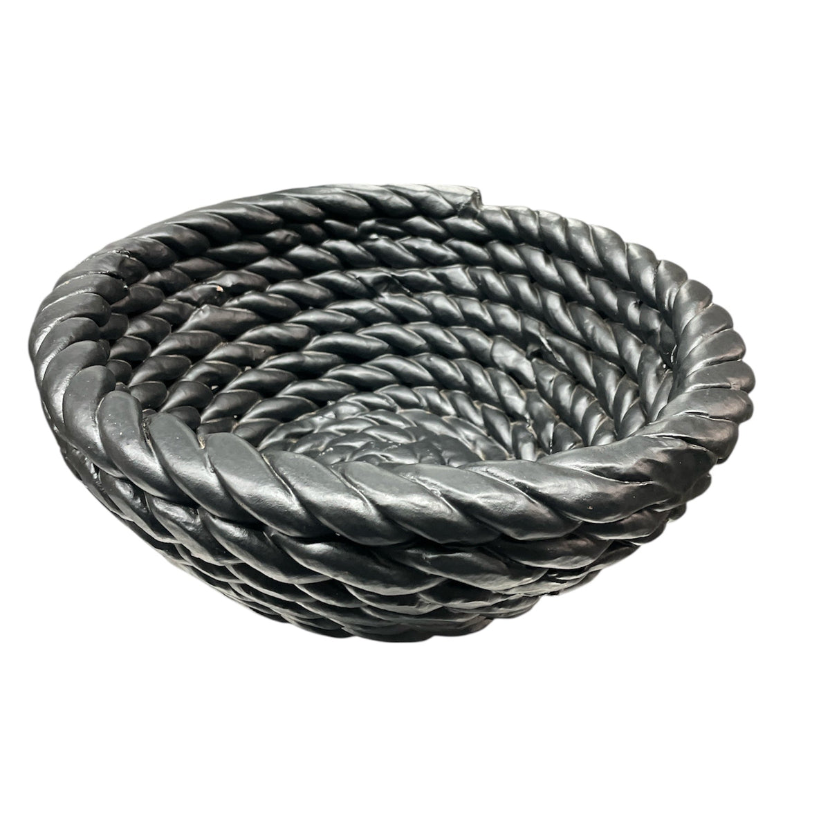 The Tissit Bowl Matte Black by Schwung Design is a round ceramic piece with a thick twisted rope spiral design, matte black finish, and smooth texture—serving as a striking modern accent against a white backdrop.