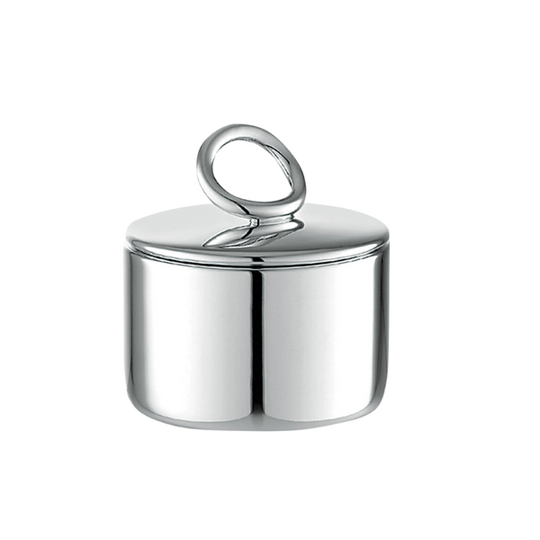 The Christofle Vertigo Silver Plated Sugar Bowl features a shiny, cylindrical design with a smooth surface and a round, looped handle, shown against a white background.