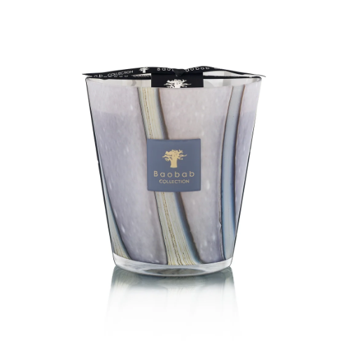 The Baobab Woods Broceliande Candle features a gray, marble-patterned glass and a black ribbon top, displayed on a reflective surface—evoking the mystical Brittany forest of Brocéliande.