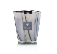 The Baobab Woods Broceliande Candle features a gray, marble-patterned glass and a black ribbon top, displayed on a reflective surface—evoking the mystical Brittany forest of Brocéliande.