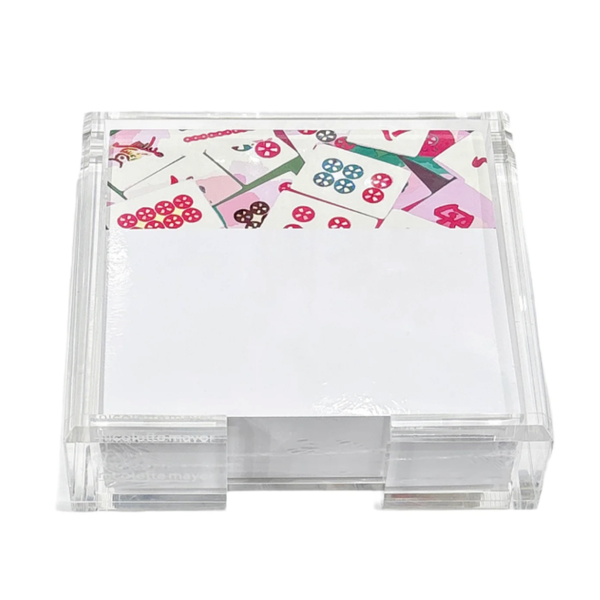 The Nicolette Mayer Mahjong Note Cards with Acrylic Holder features stylish square white cards in a clear acrylic display—colorful, patterned designs peek out at the top, making it a perfect game night gift.