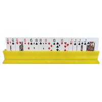 The Canasta Sets Canasta Rack holds playing cards upright and organized, showing assorted suits and numbers—ideal for arranging your Canasta set or other card game accessories.