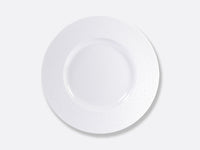 The Ecume White Dinnerware by Bernardaud is a round, white plate with a wide, textured rim, crafted in France from fine Limoges porcelain and shown from above on a plain light gray background.
