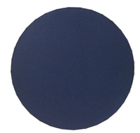 A round, navy blue Charm Placemat Navy with a textured, beaded surface crafted from phthalate-free vinyl.