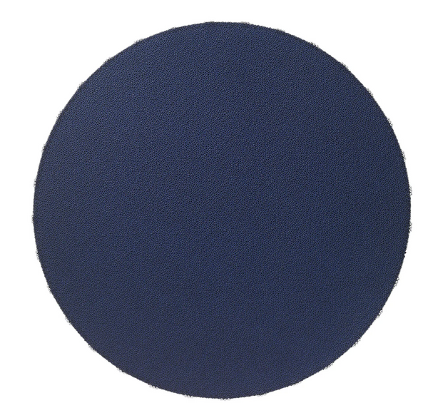 A round, navy blue Charm Placemat Navy with a textured, beaded surface crafted from phthalate-free vinyl.
