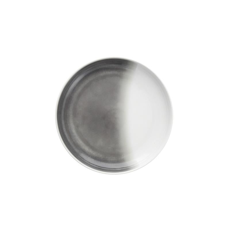 The La Cotera Melamine Dinnerware Gray by Fortessa is a round plate featuring a gradient from dark gray to white, shown on a white background—ideal for those seeking durable, dishwasher-safe dinnerware.