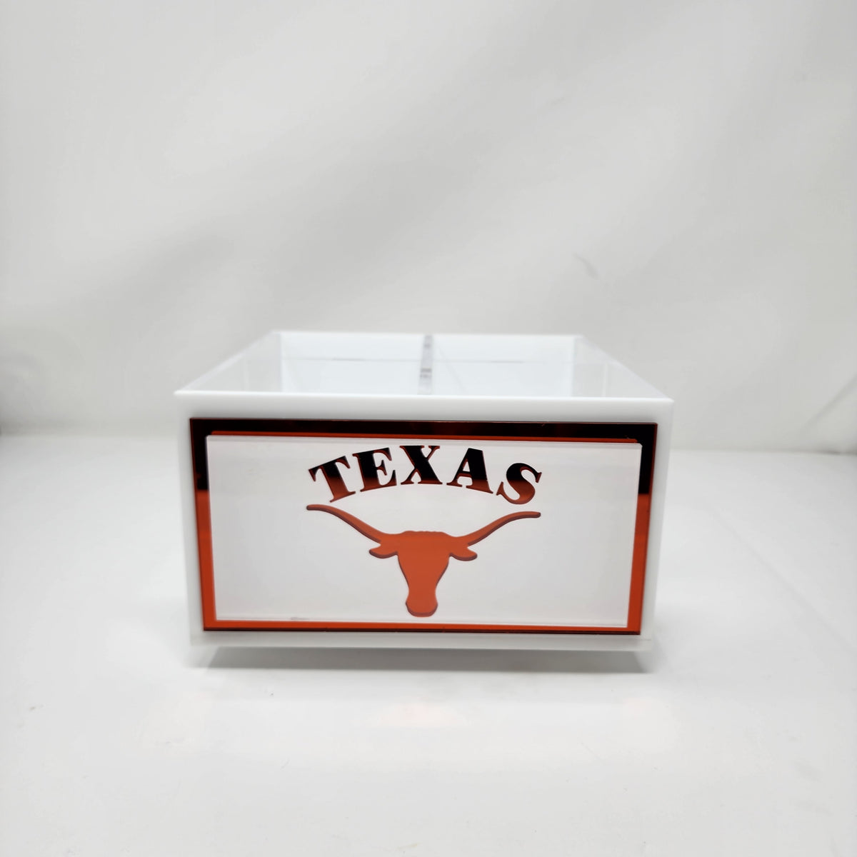 The Eye Candy College Spinner is a white box with "TEXAS" and an orange longhorn silhouette on the front, bordered in orange and black—ideal as a college desk organizer and featuring a custom college logo on a plain white background.